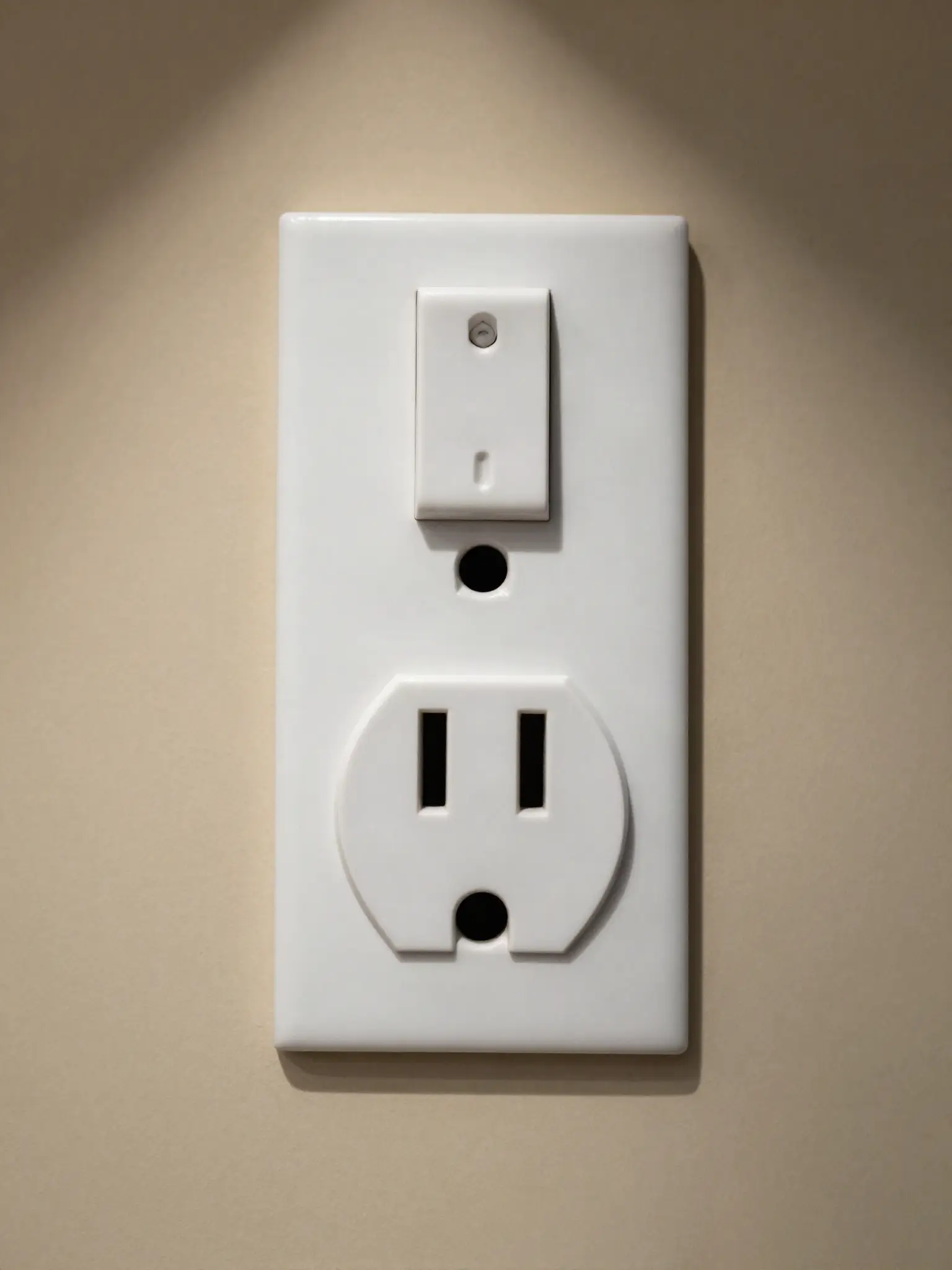 Close-up of a newly installed white duplex receptacle and rocker switch on a freshly painted wall